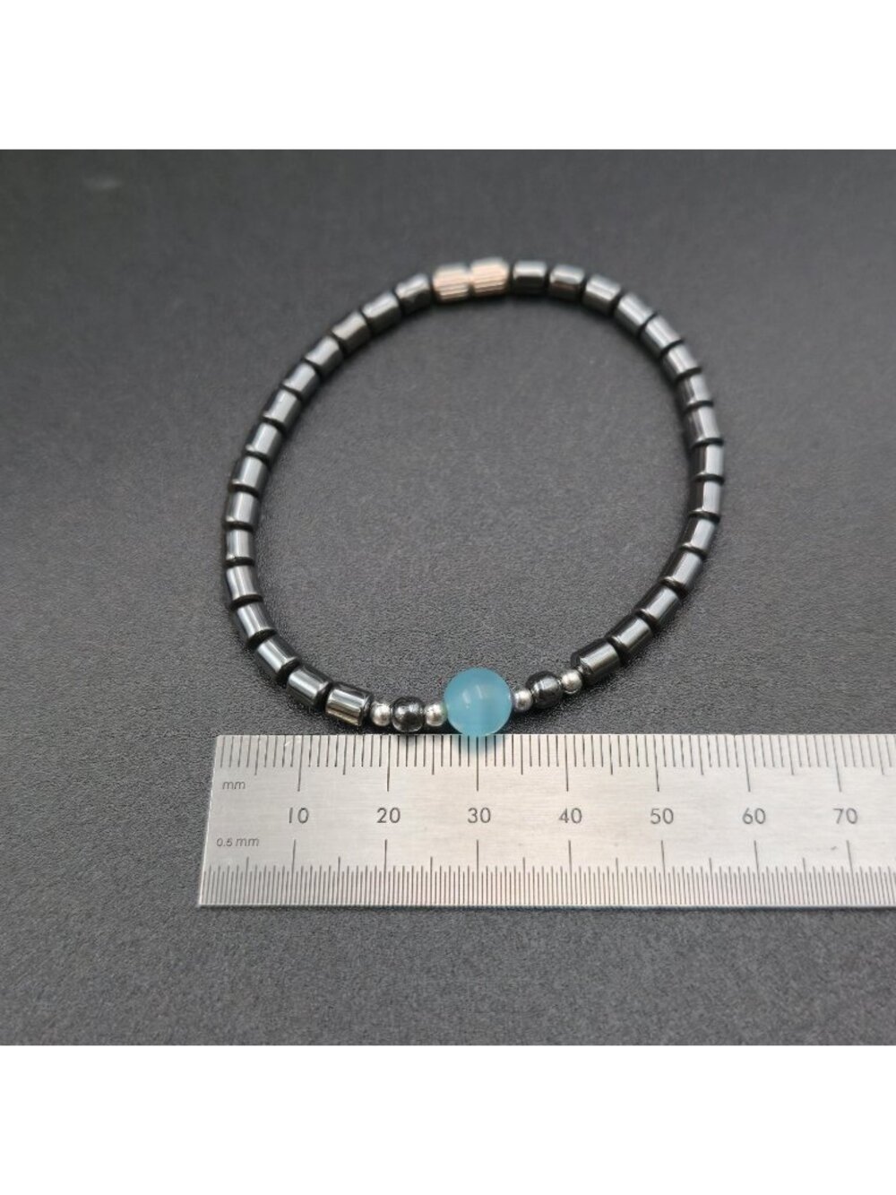7 Inch Hematite Cylinder Bracelet with Light Blue Cat's Eye Focal Bead Bracelet - Picture 5 of 6